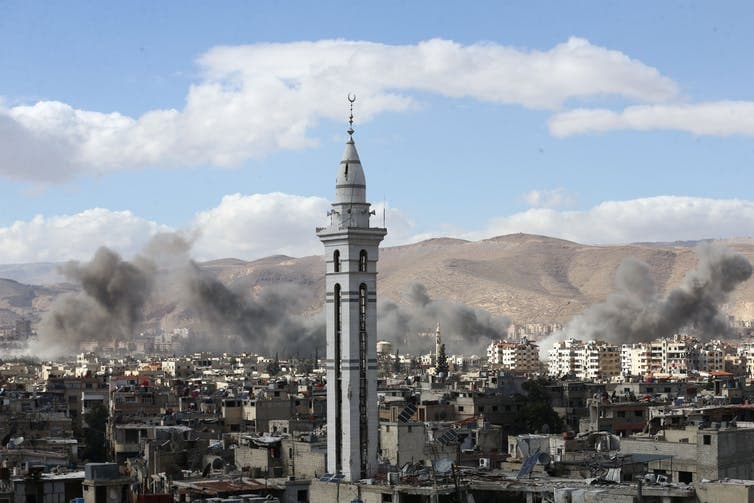 Smoke rises from the besieged Ghouta