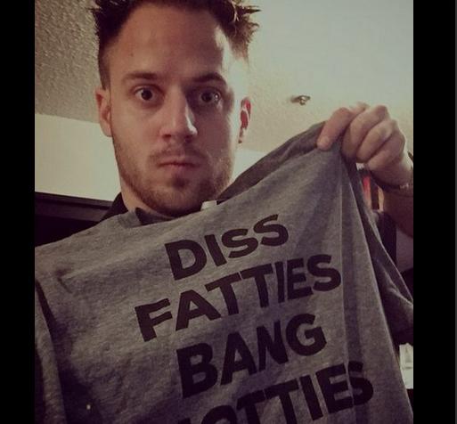 Julien Blanc posing with offensive t-shirt
