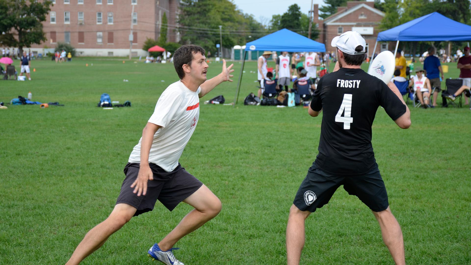 Alex Trahey, left, plays defense during a warm-up against a teammate. In mixed, men guard men, and women guard women.