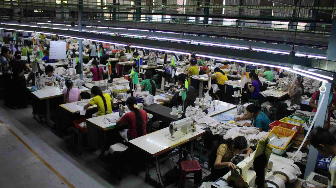 Rows of garment workers work on a factory floor in Myanmar