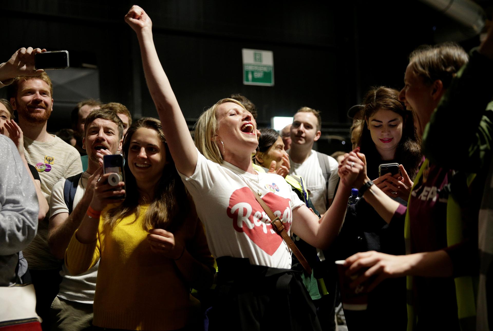 Activists react at the count centre