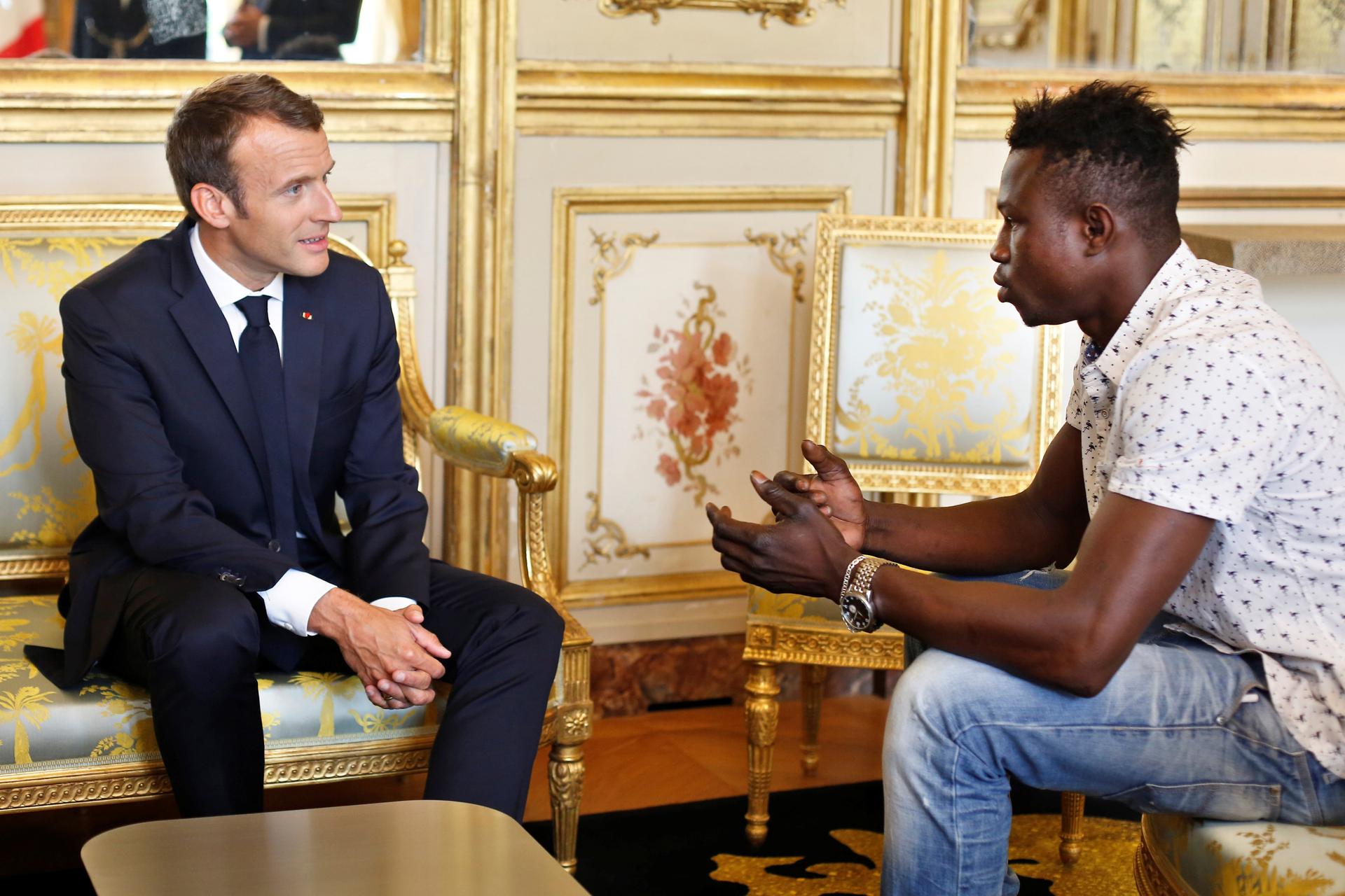 Emmanuel Macron, left, meets with Mamoudou Gassama