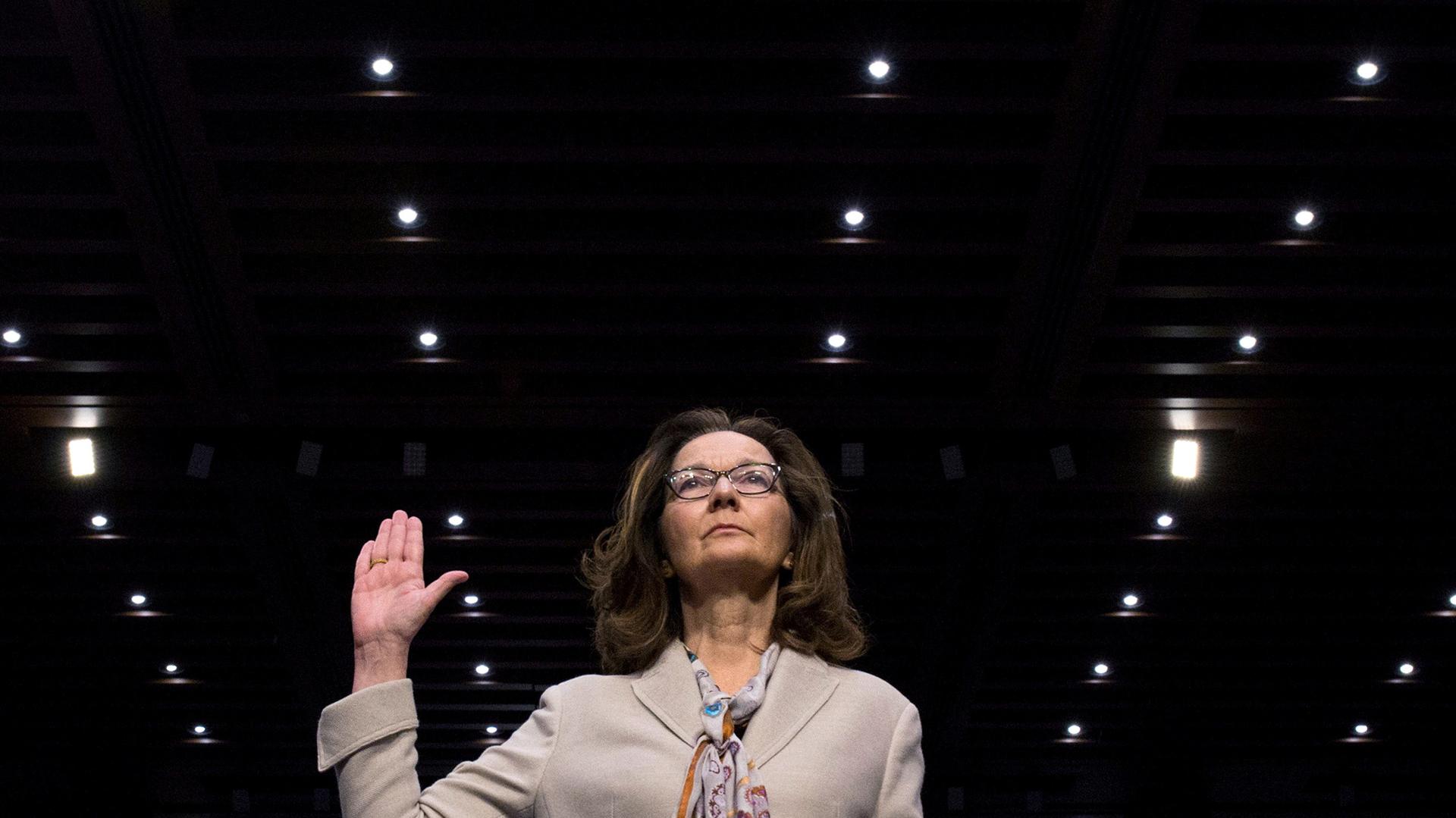 CIA director nominee Gina Haspel raises her right hand as she is sworn in to testify at her Senate Intelligence Committee confirmation, May 9, 2018. 
