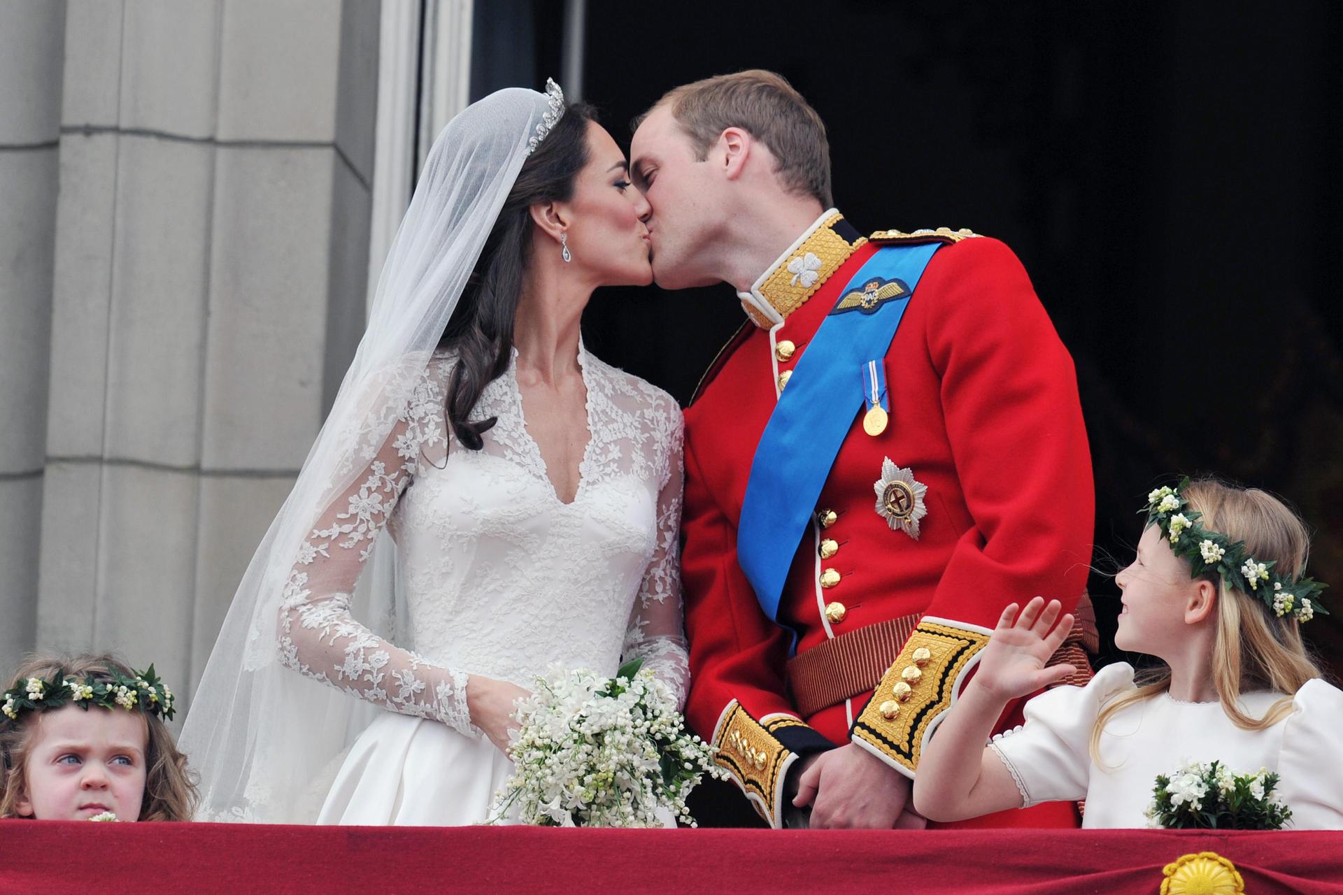 Prince William and Princess Kate kiss on the balcony of Buckingham Palace at their wedding in 2011.