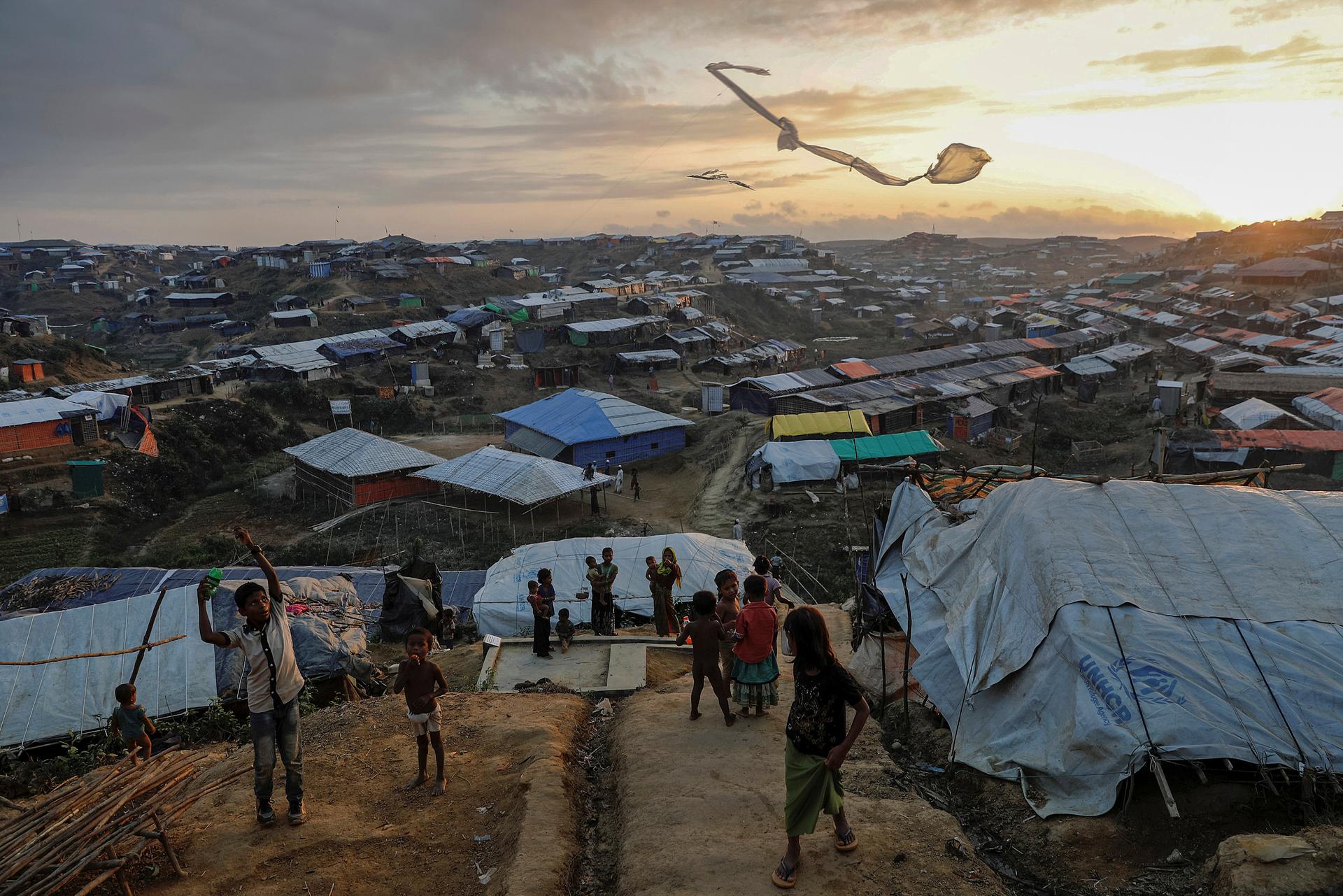 Rohingya refugee children fly improvised kites at the Kutupalong refugee camp near Cox's Bazar, Bangladesh.