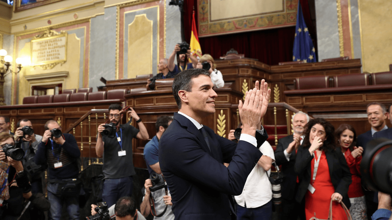 Spain's new prime minister, Pedro Sanchez, smiles.