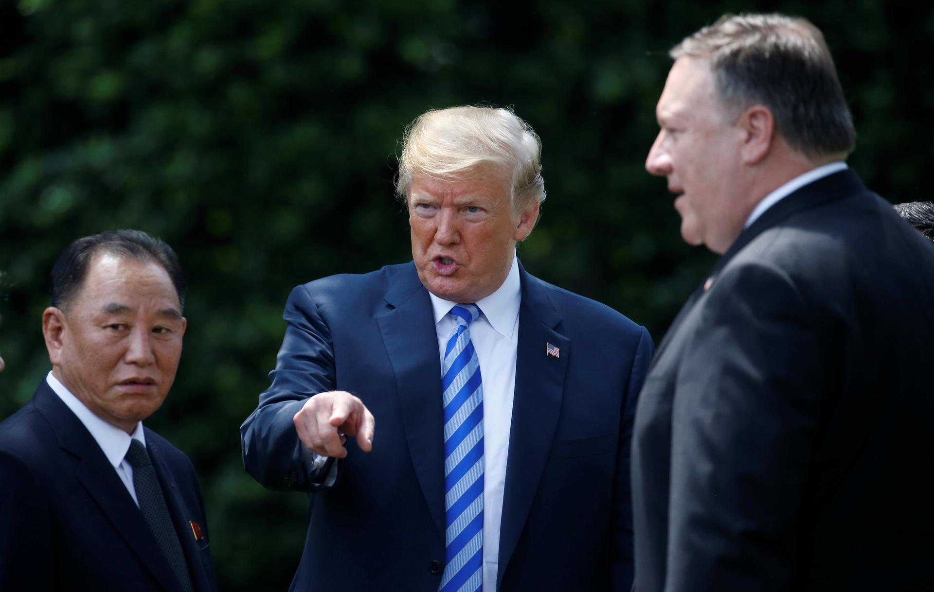 North Korean envoy Kim Yong-chol talks with US President Donald Trump as Secretary of State Mike Pompeo looks on