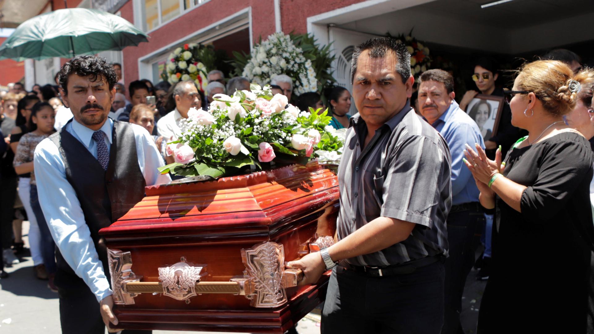 family members carry the coffin in a murdered political candidate in mexico