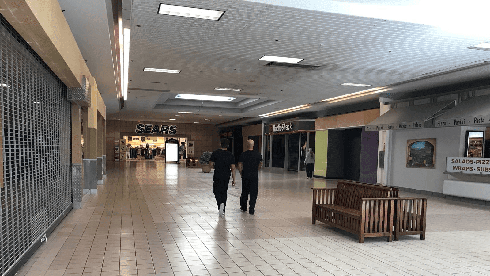 the interior of a nearly abandoned shopping mall in the US