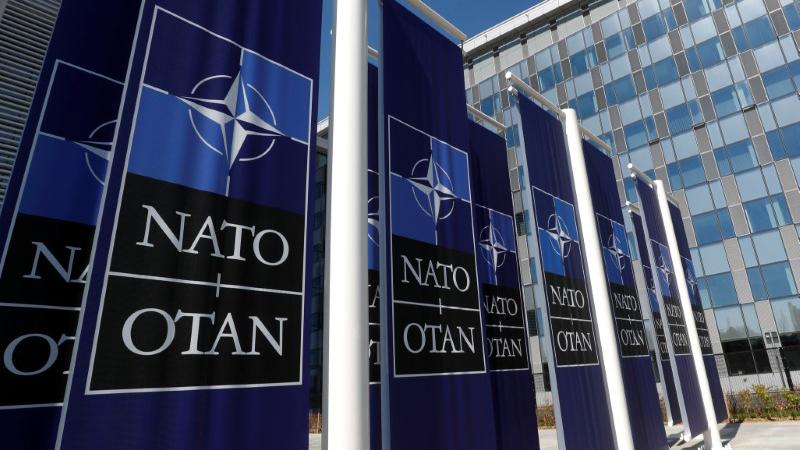 Banners displaying the NATO logo are placed at the entrance of new NATO headquarters, in Brussels.