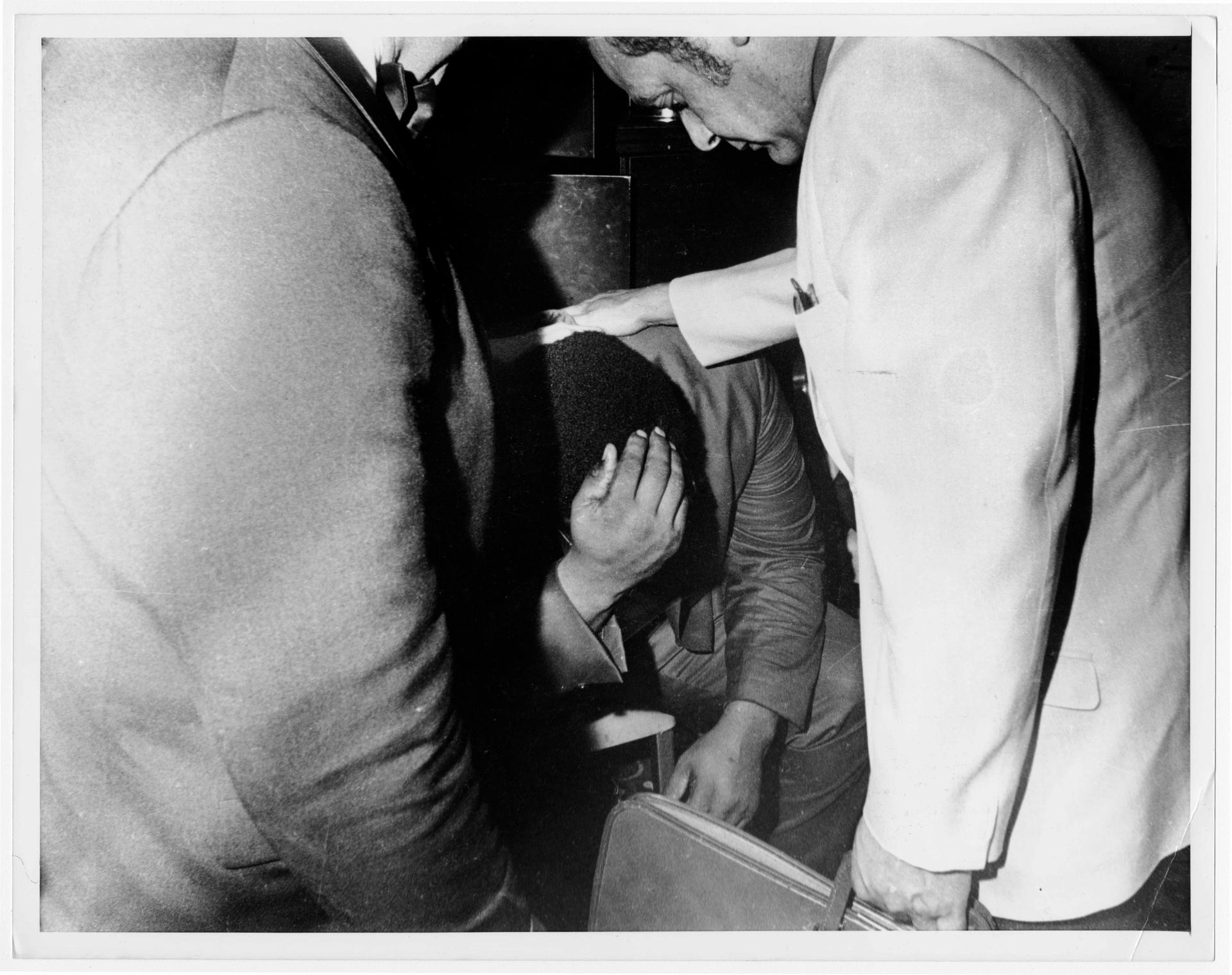 Roosevelt Grier, one of Robert Kennedy’s entourage who helped wrestle the gun out of Sirhan’s hands, breaks down after the shooting.