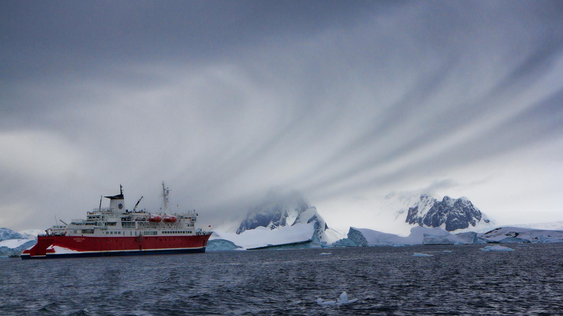A ship carrying tourists plies the waters off Antarctica.