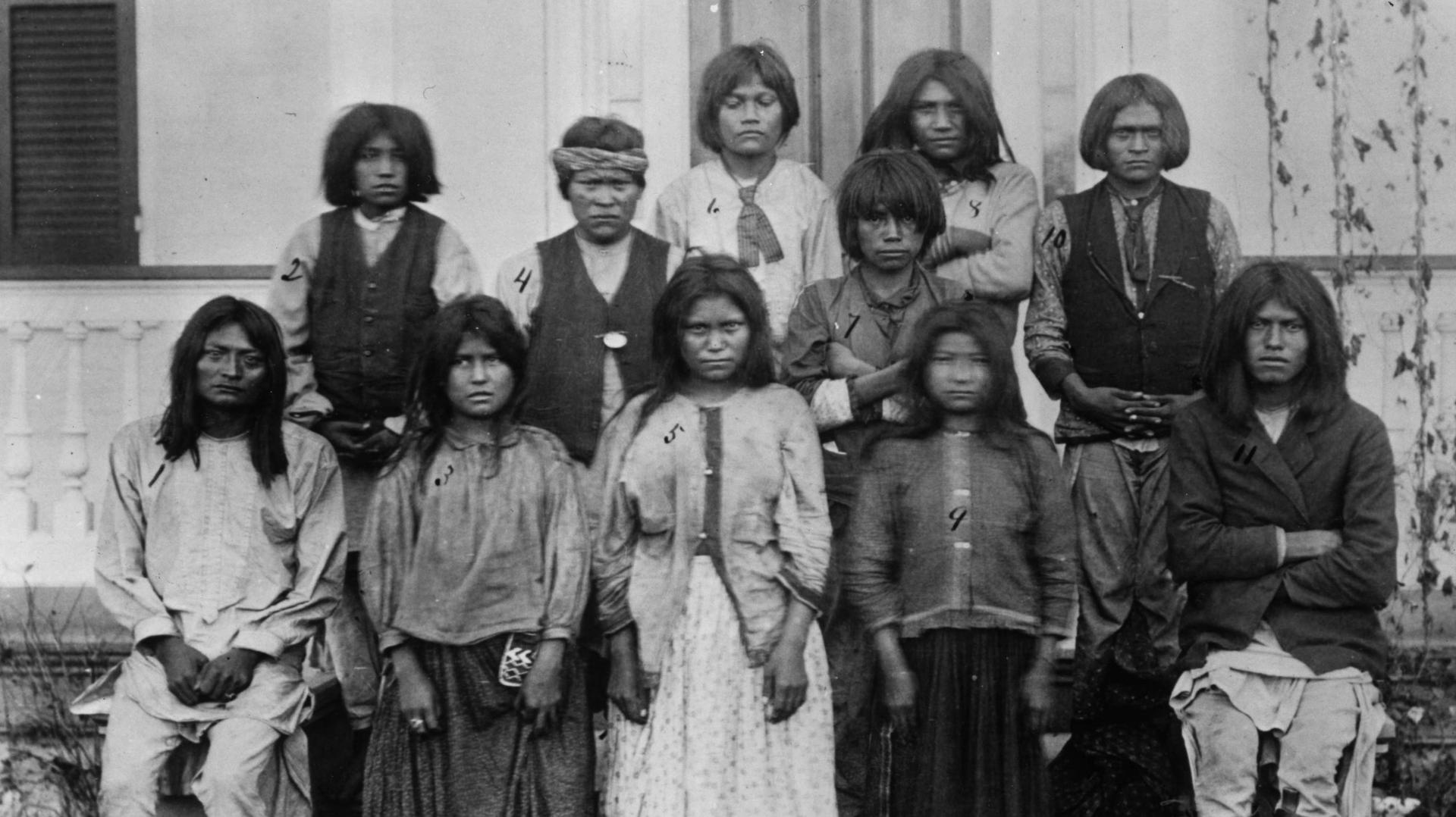 A group of Chiracahua Apaches on their first day at Carlisle Indian school, 1886.