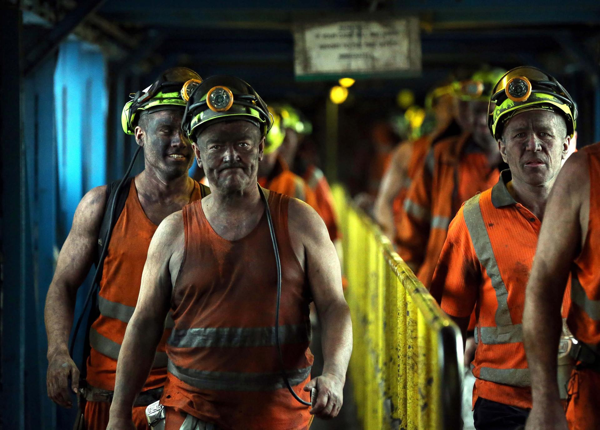 Miners leave after working the final shift at Kellingley Colliery