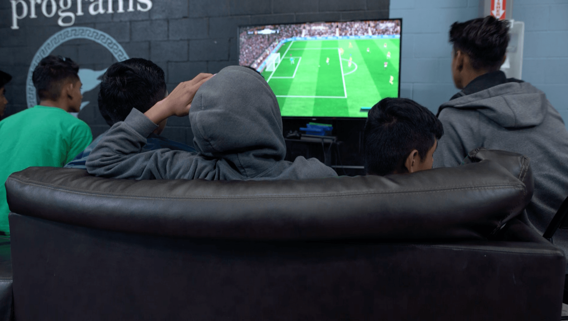 Teenage boys play video games at Casa Padre, a facility for migrant children in Brownsville, Texas. 