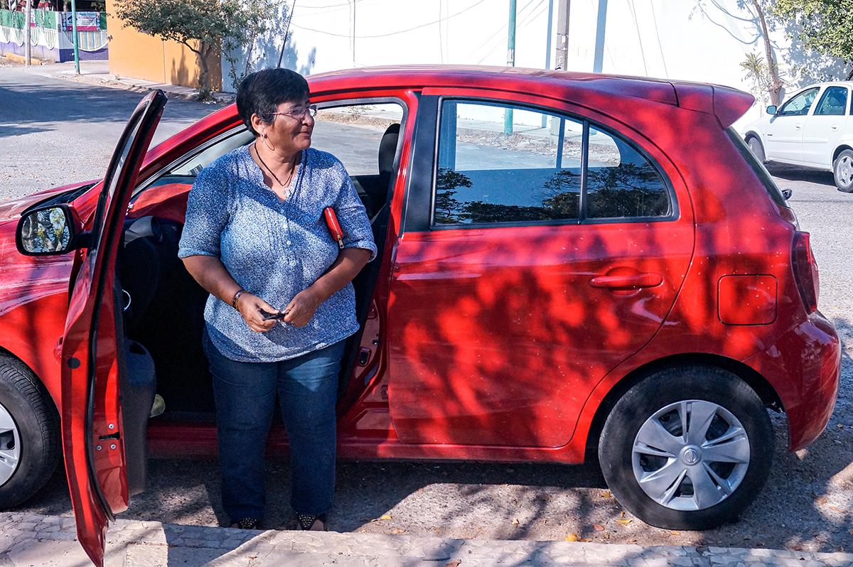 Patricia Torres Matus, 63, uses her personal car to help her friends and family get around the city.