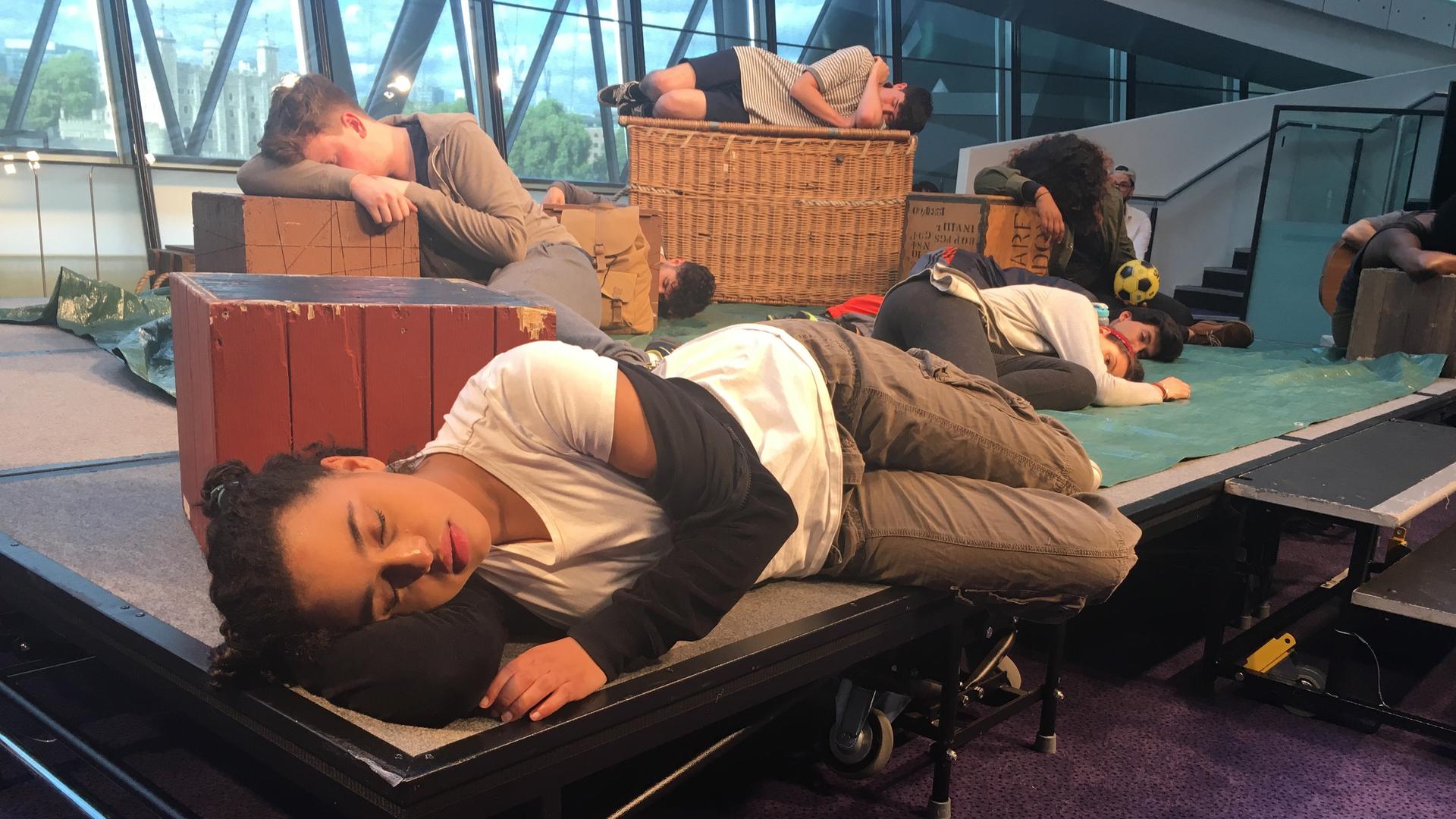 Yusra, played by Rhianna Merralls, struggles to fall asleep in the play, "Wherever I Lay My Head," performed in London City Hall.