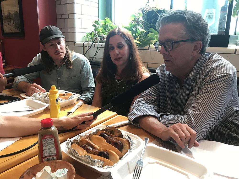 Kurt Andersen speaks with Laura DeMarco and John Riepenhoff inside the West Side Market Cafe.