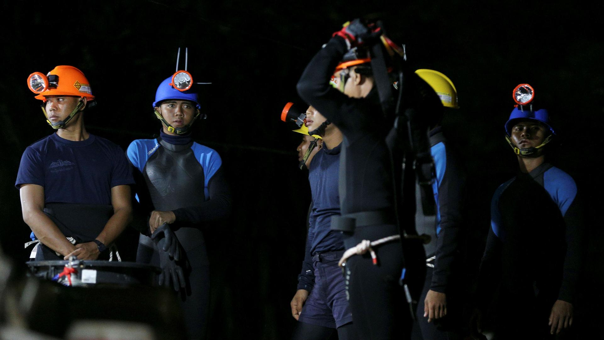 Thai divers gather before they enter to the Tham Luang cave, where 12 boys and their soccer coach are trapped, in the northern province of Chiang Rai, Thailand, July 6, 2018.