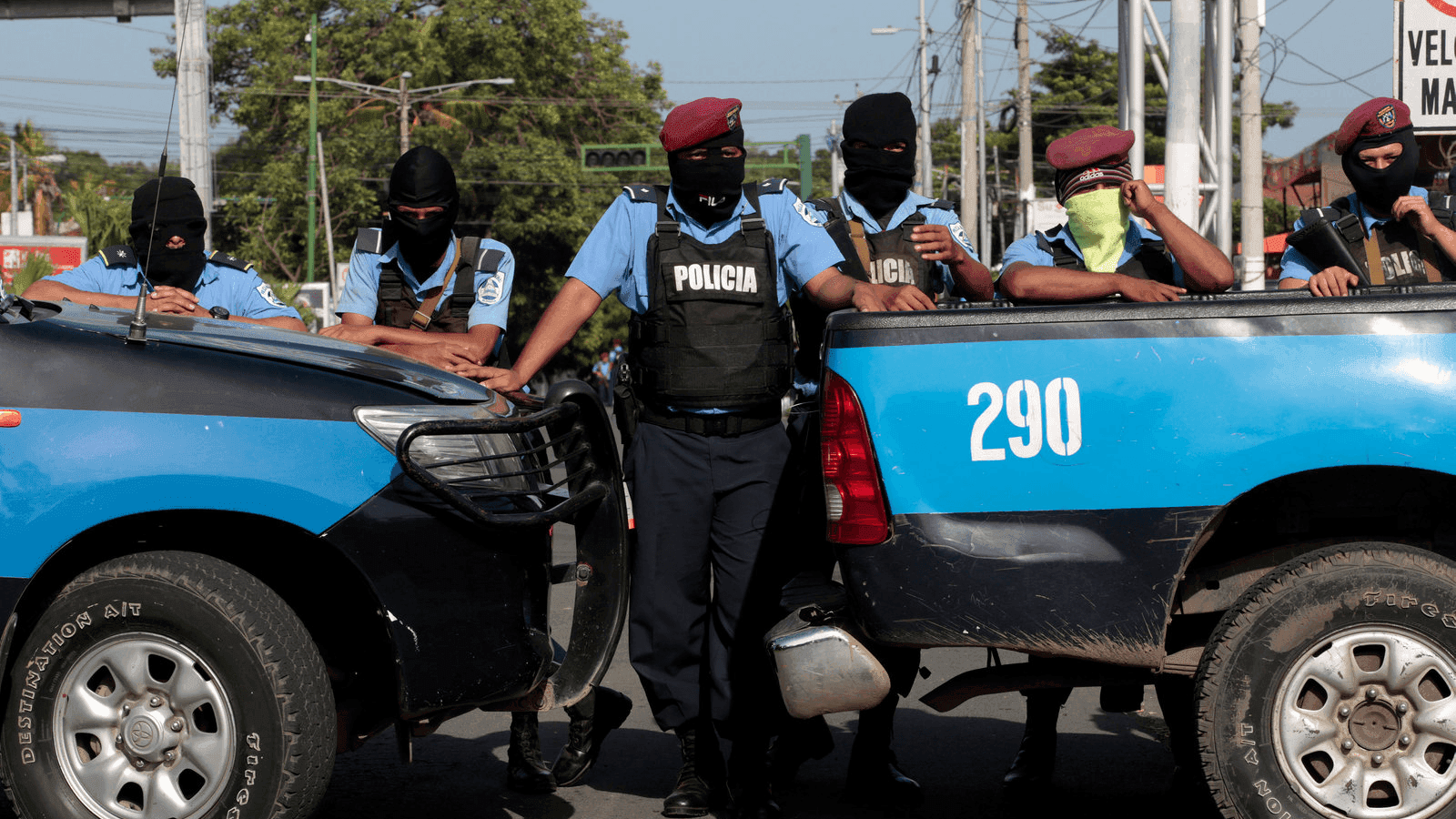Masked police block the entrance of Divine Mercy Catholic Church in Managua, Nicaragua,
