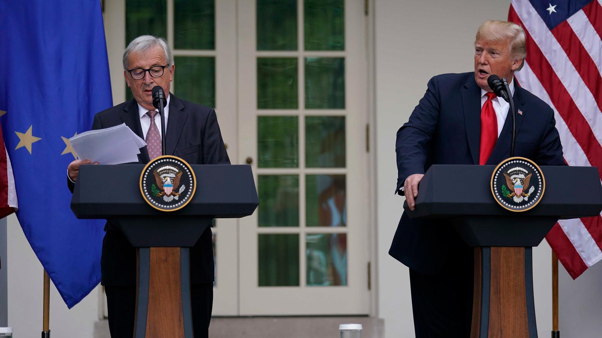 European Commission President Jean-Claude Juncker and US President Donald Trump stand at podiums in the Rose Garden of the White House, July 25, 2018.