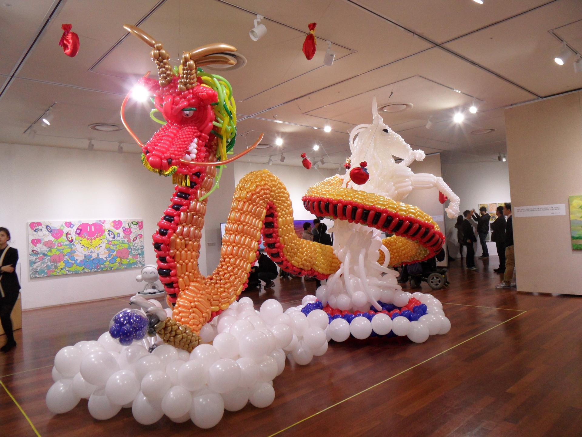 a balloon sculpture of a dragon and unicorn