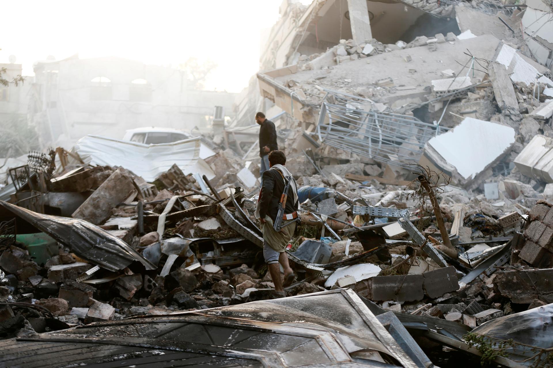 Man stands on pile of rubble