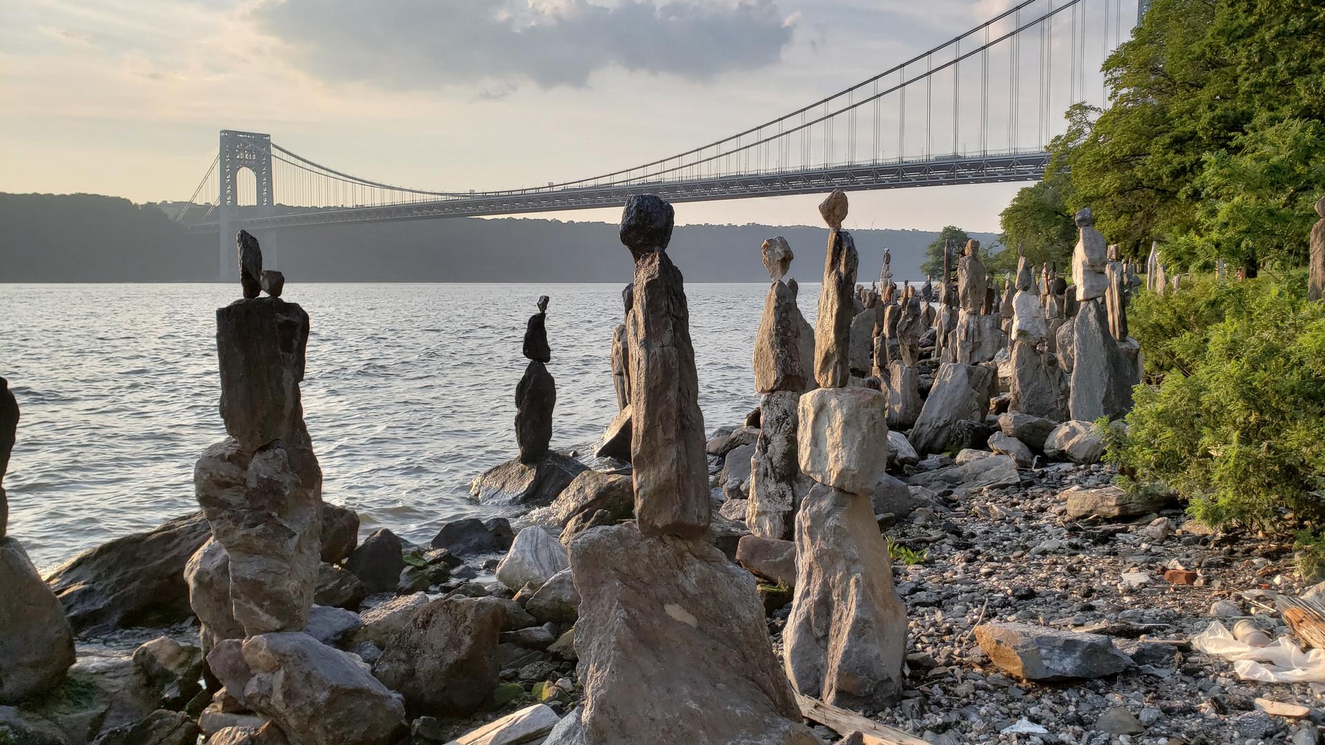 The Sisyphus Stones stretch out along the Hudson in Manhattan. They're the work of one man, Uliks Gryka, who has spent hours almost every day, erecting and maintaining them.