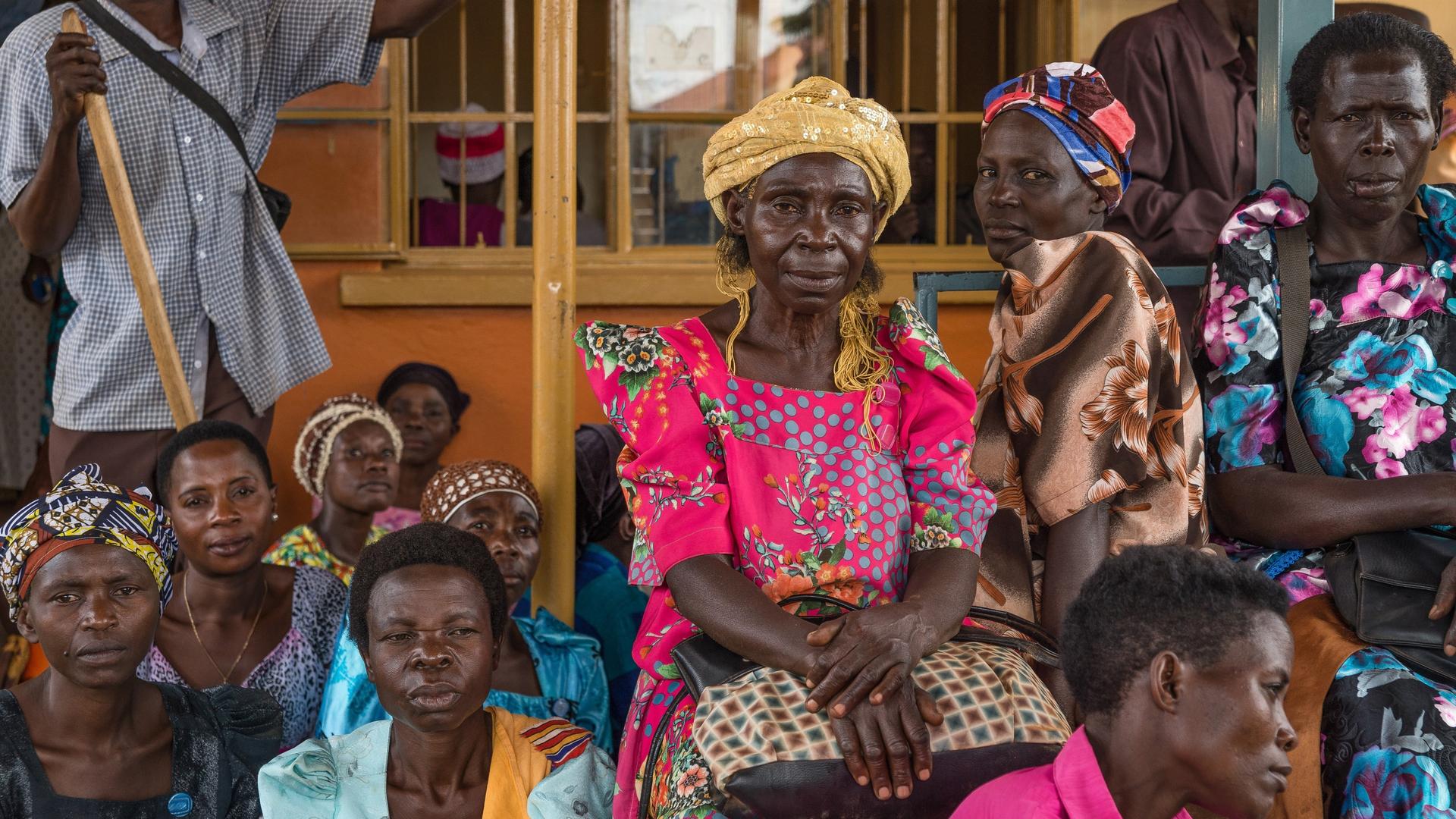 Patients wait to collect their HIV medication in Uganda at Mayuge Health Centre III in Uganda.