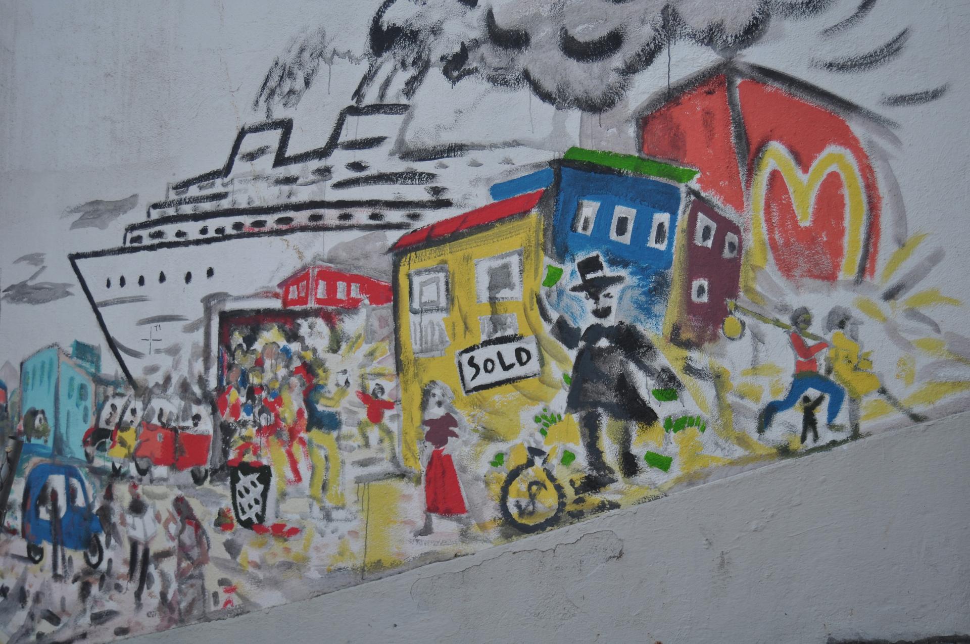 an anti-gentrification mural in lisbon