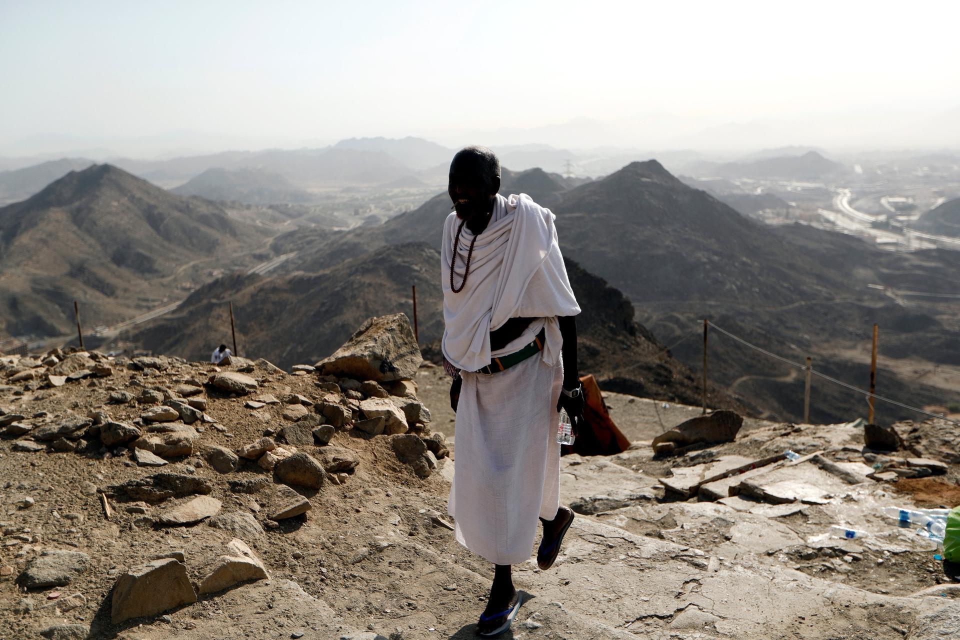 A muslim pilgrim climbs Mount Al-Noor