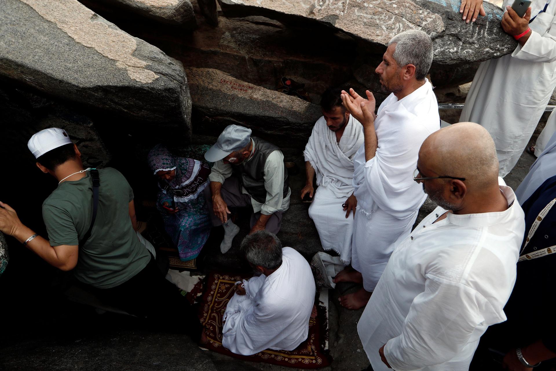 Muslim pilgrims pray at Mount Al-Noor