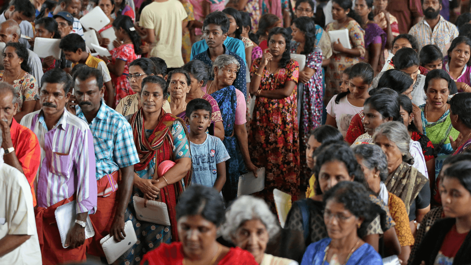 hundreds of people wait for aid in Kerala, India after floods