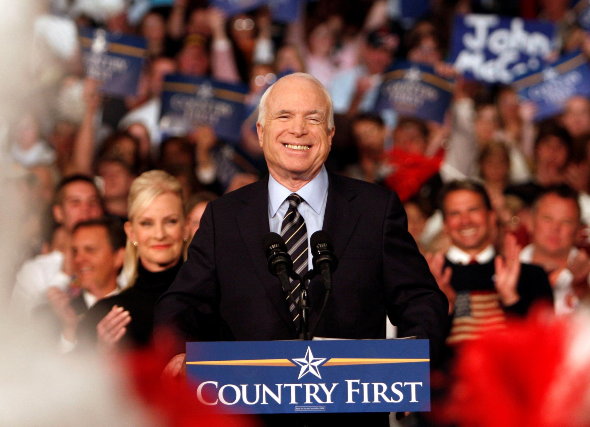 US Republican presidential nominee Senator John McCain (R-AZ) waves to the crowd