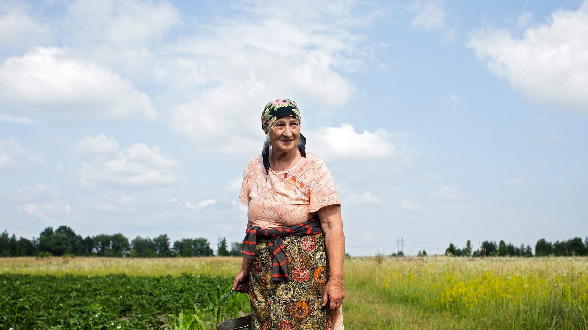 and old woman in a field 