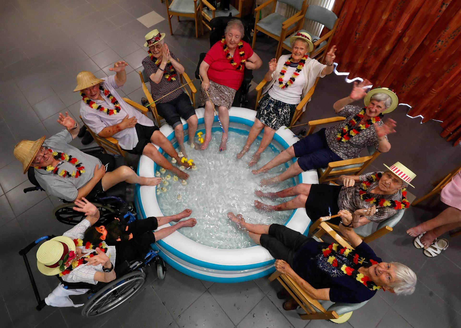 Residents at the Ter Biest house for elderly persons refresh their feet in a pool in this over-head photograph.