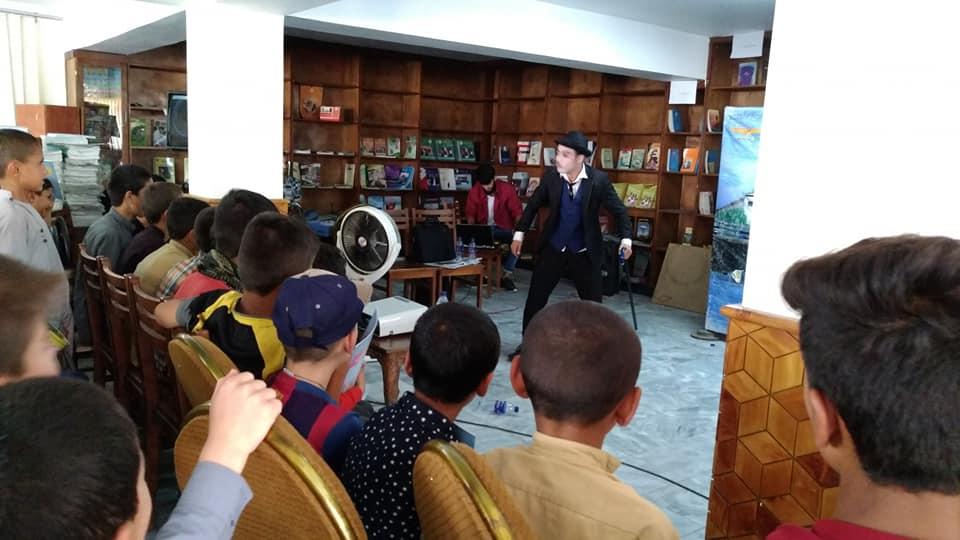 Karim Asir performs at an orphanage in Kabul.
