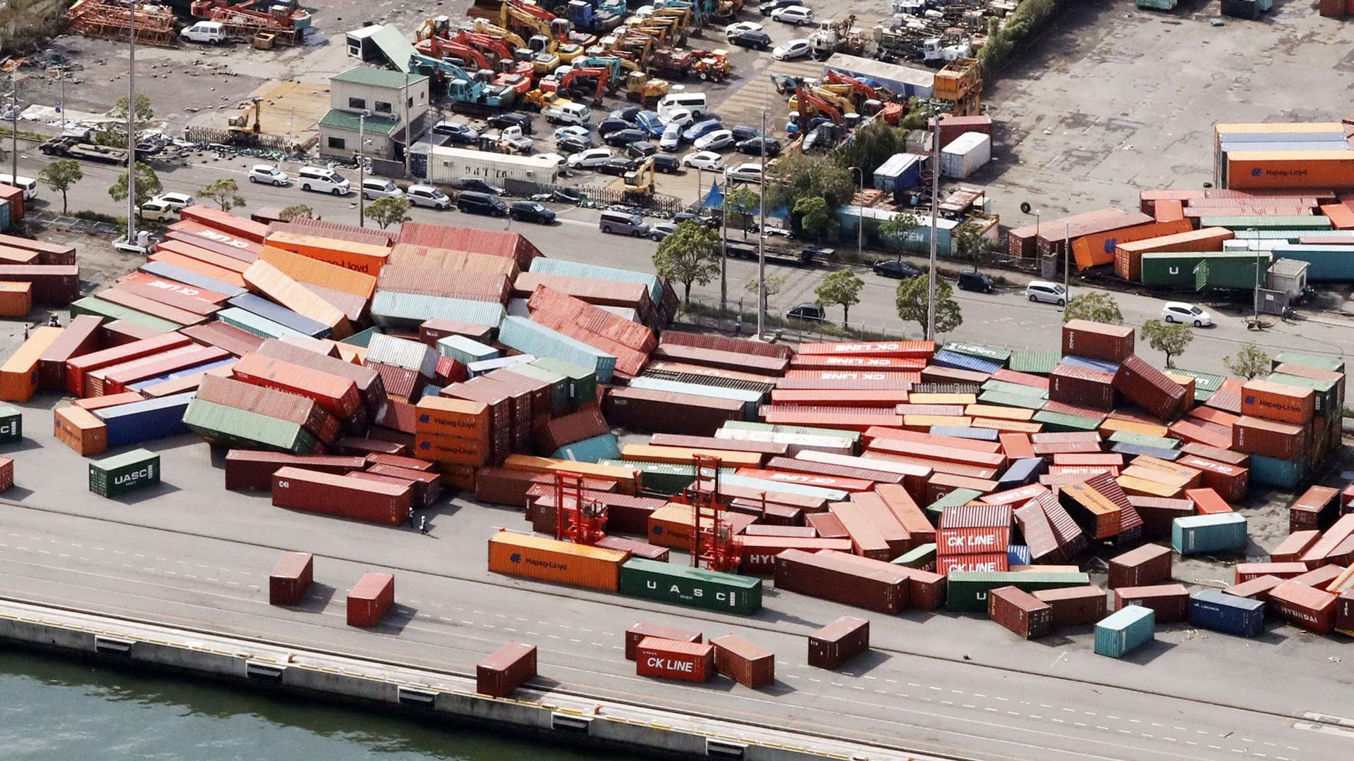Shipping containers are shown fallen over on top of one another damaged by Typhoon Jebi..