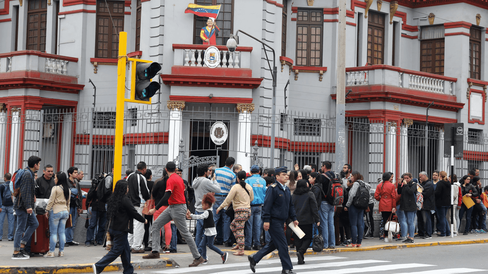 venezuelans gather outside their embassy in lima