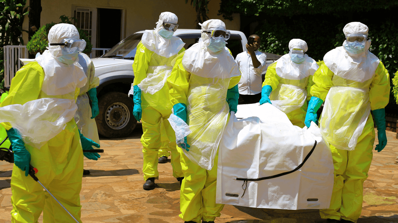 Congolese officials wear haz-mat suits in the DRC