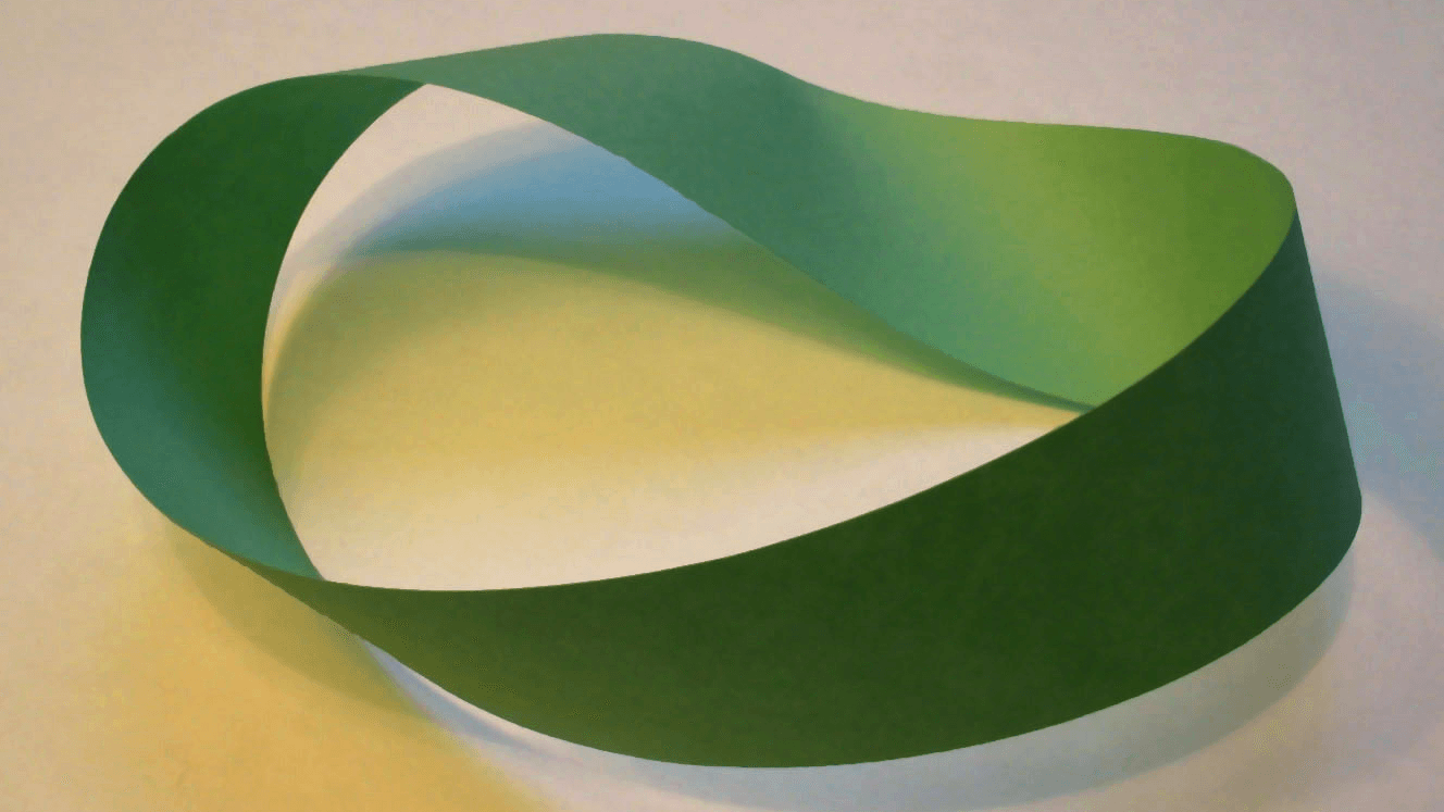 A Mobius strip made with a piece of paper and tape.