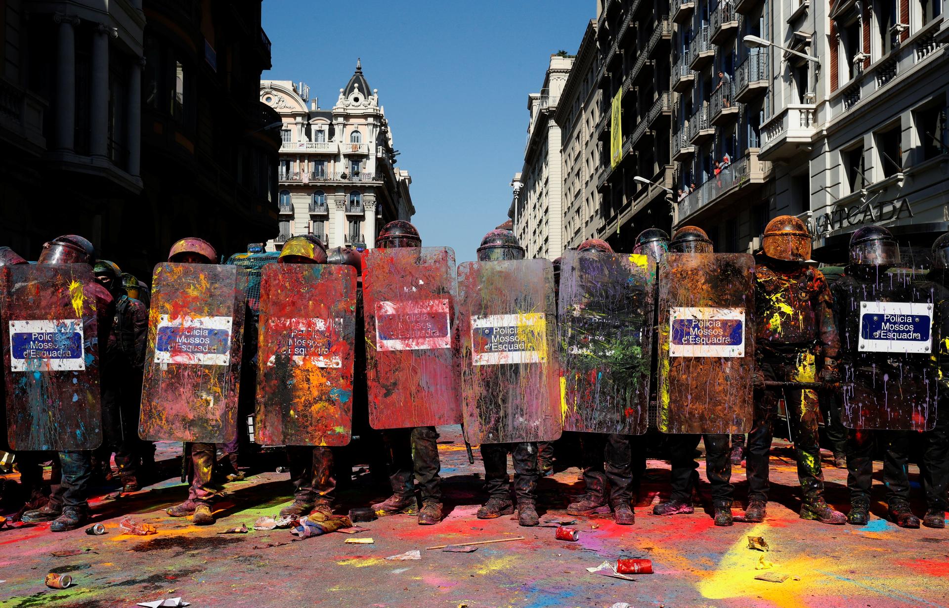 a police squadron covered in colorful powder
