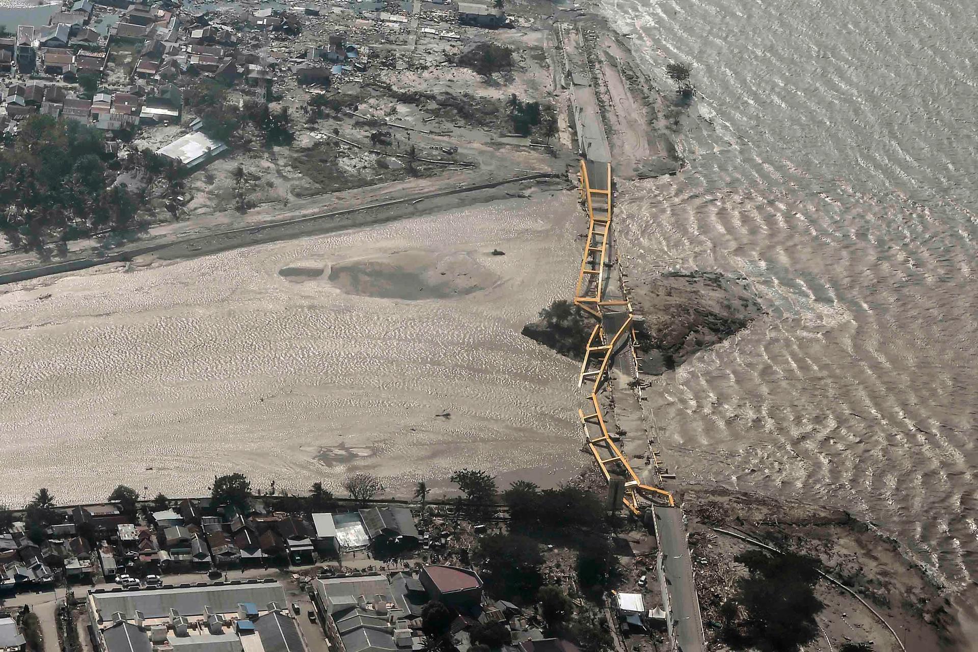 An aerial view shows bridge damaged by an earthquake and tsunami i