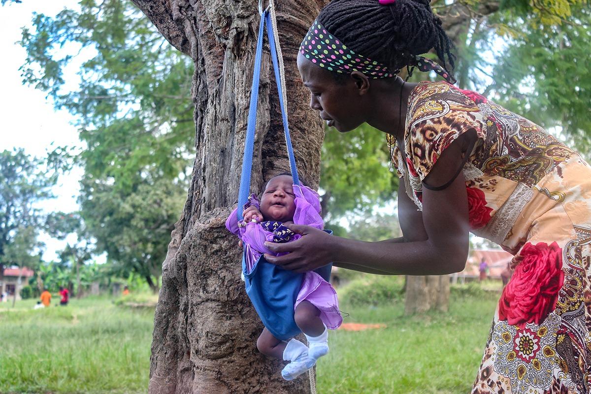 Mothers who attend nutrition classes in Matyebili, Uganda, have a chance to weigh their children
