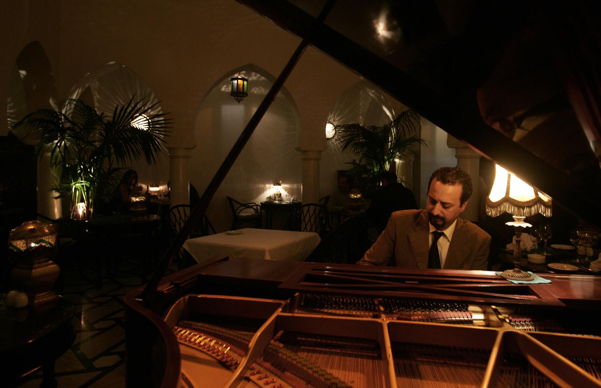 Pianist Issam Chabaa plays at Rick's Cafe in Casablanca
