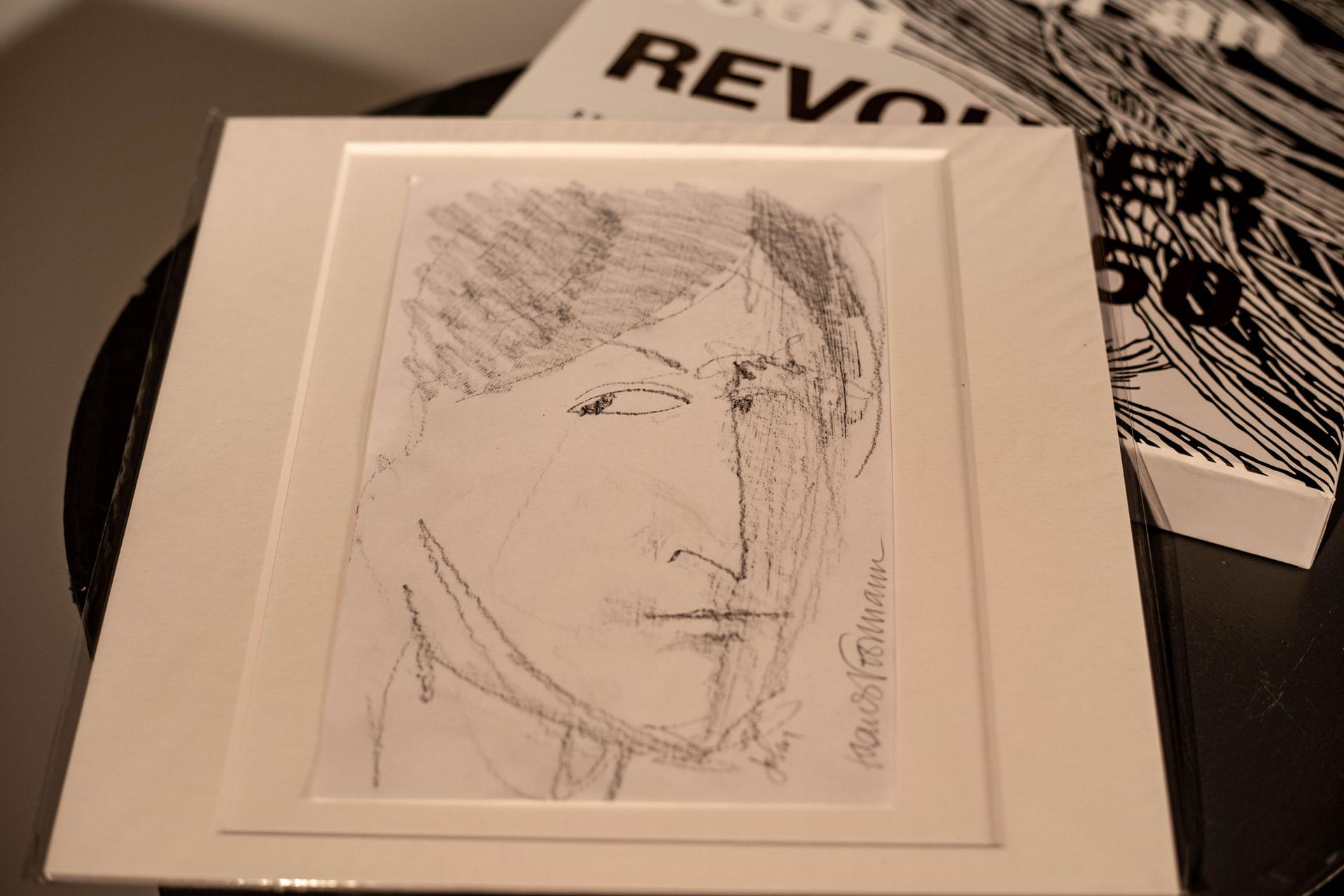 A pen and ink portrait of John Lennon by Klaus Voorman
