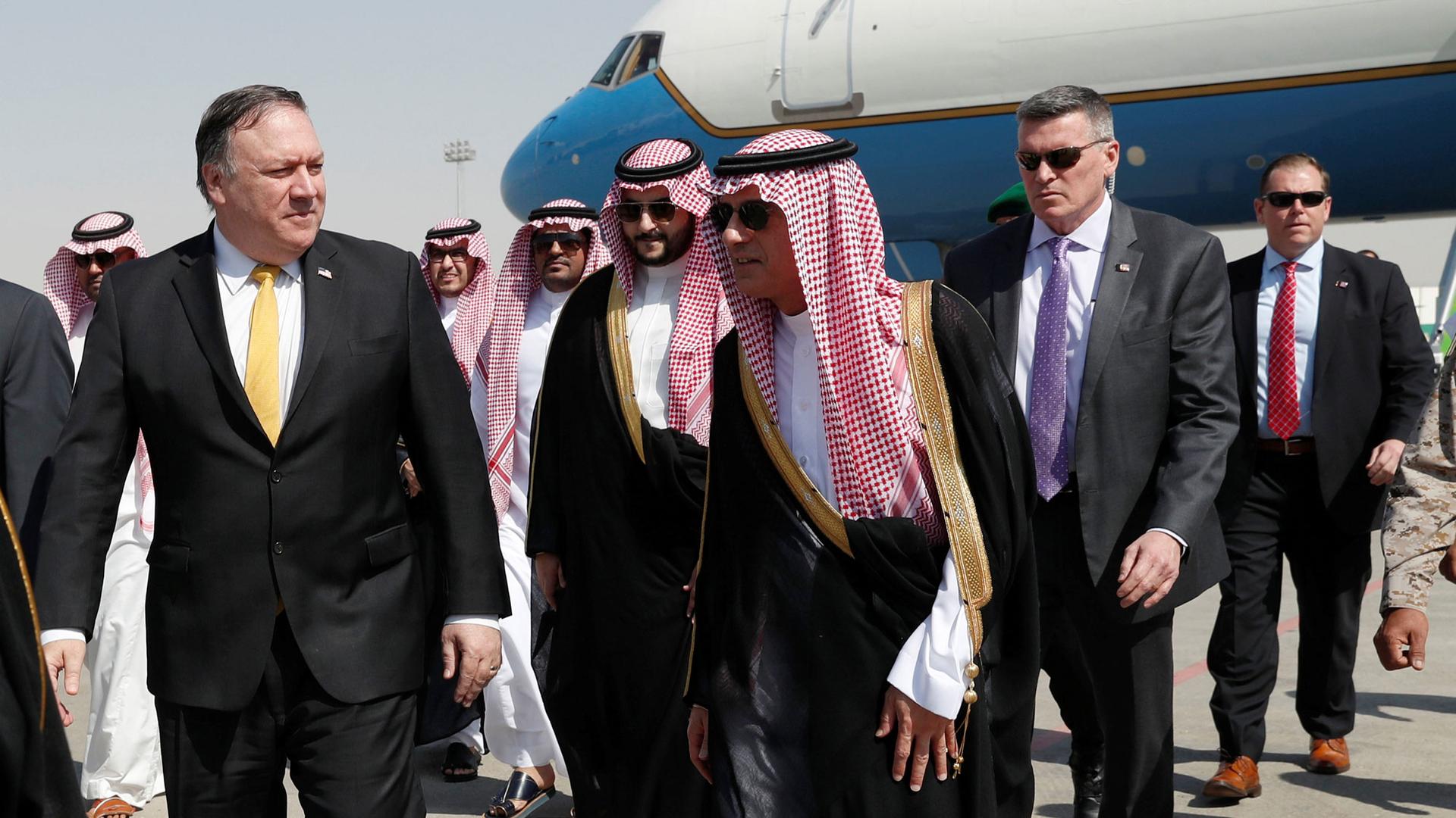 US Secretary of State Mike Pompeo is shown walking with Saudi Foreign Minister Adel al-Jubeir on the tarmac after arriving in Riyadh, Saudi Arabia,.