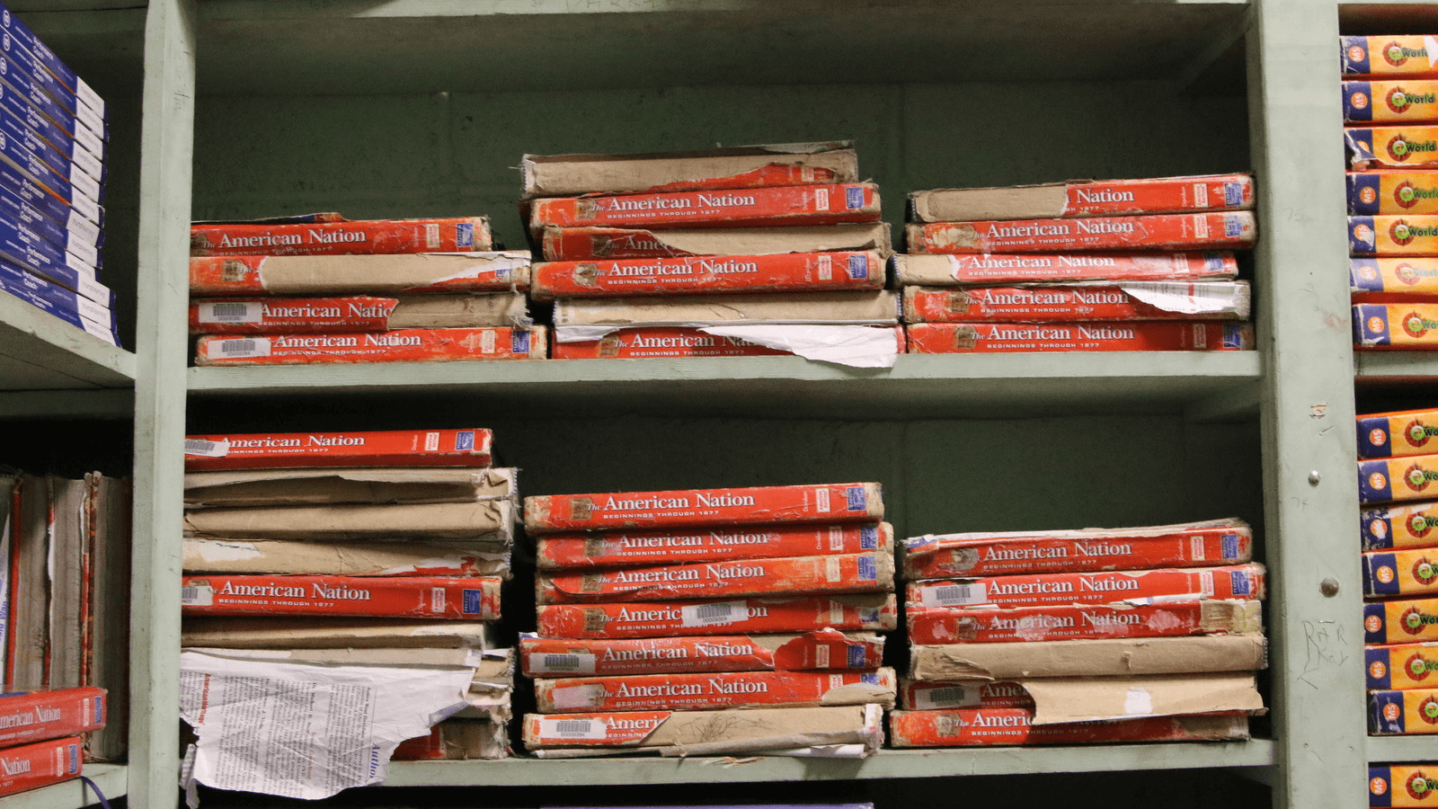 tattered textbooks at a school in mississippi