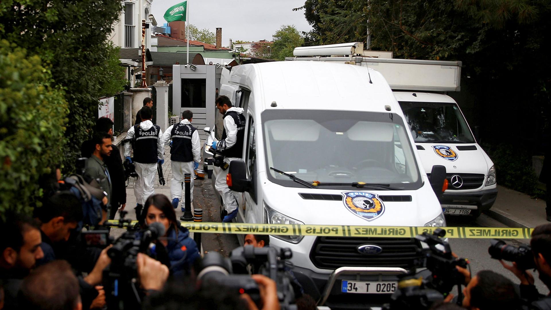 Turkish forensic officials arrive clad in white uniforms and a white van to the residence of Saudi Arabia's Consul General Mohammad al-Otaibi in Istanbul, Turkey.