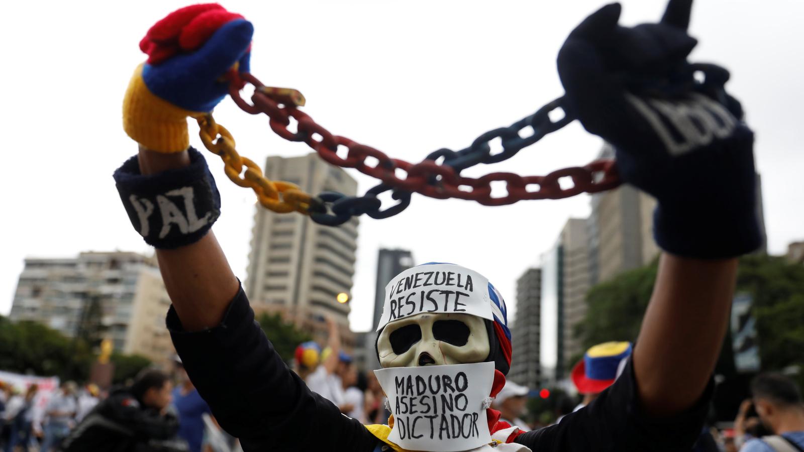 A demonstrator wears a mask at rally in Caracas, Venezuela, May 1, 2017. 